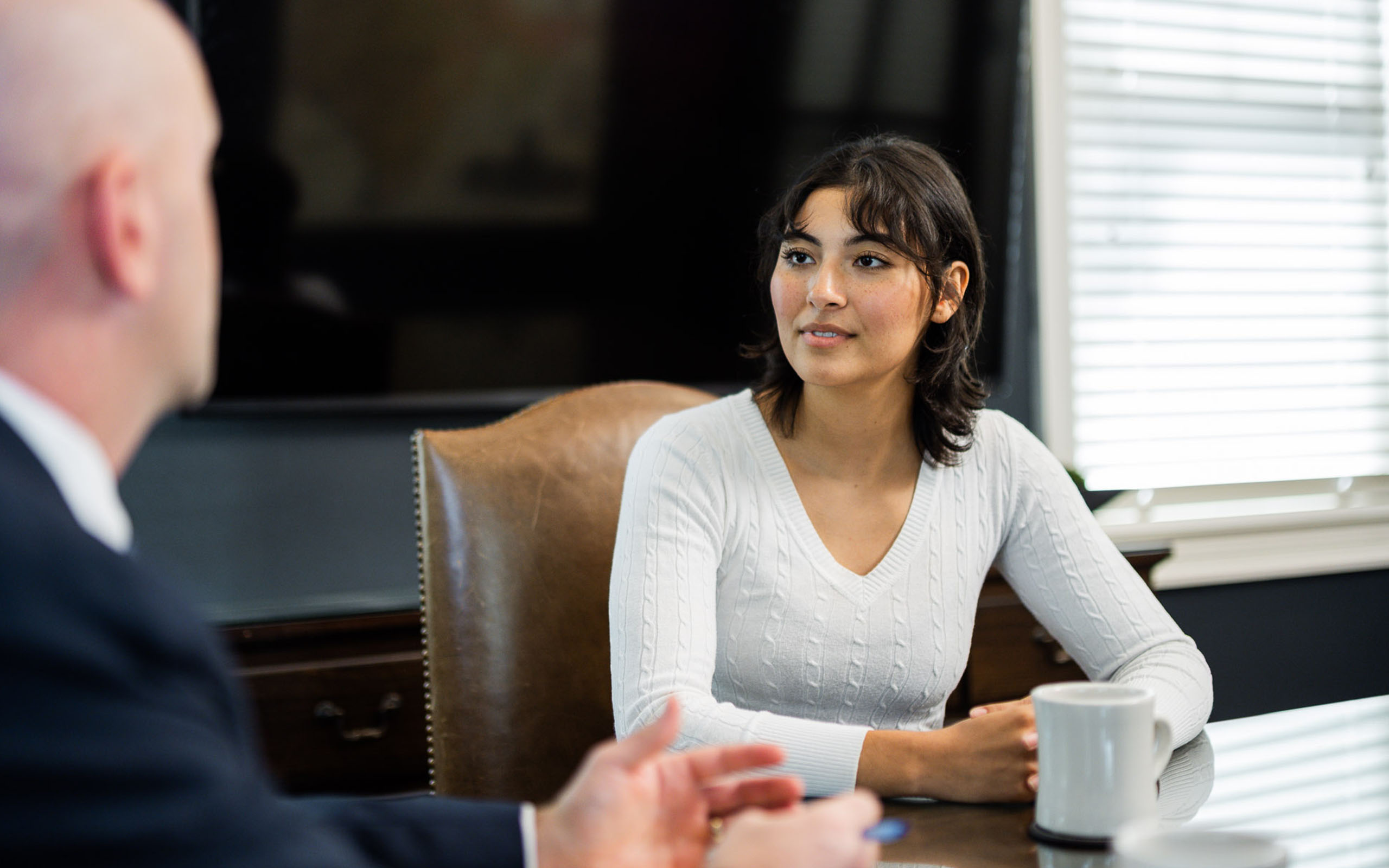 Woman smiling at a table
